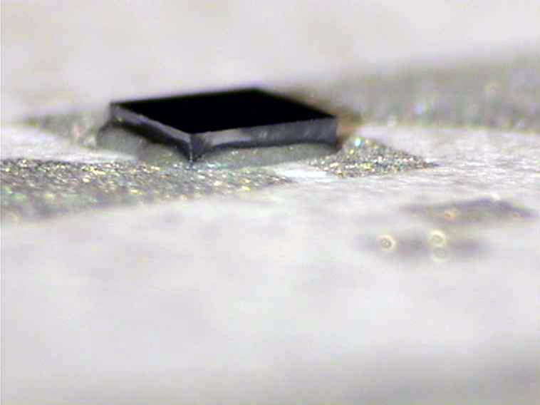 adhesive dispensed on chip adhesive dispensed on chip